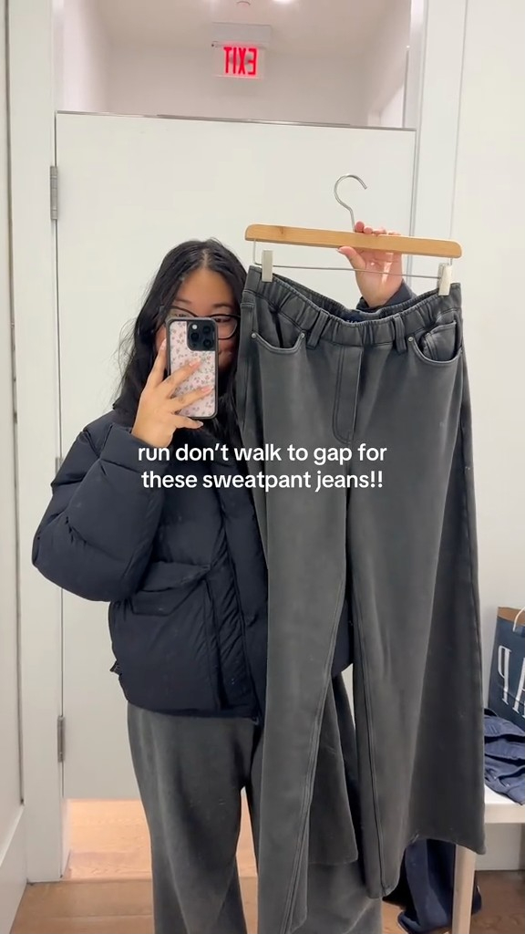 A woman taking a selfie in a pair of Gap's popular ripped and boned jeans