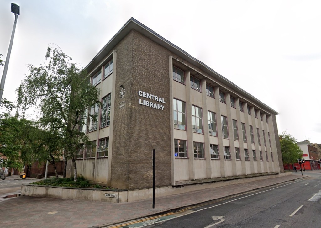 A sign on the side of Hull Central Library announcing the return of a late George Orwell book 50 years later