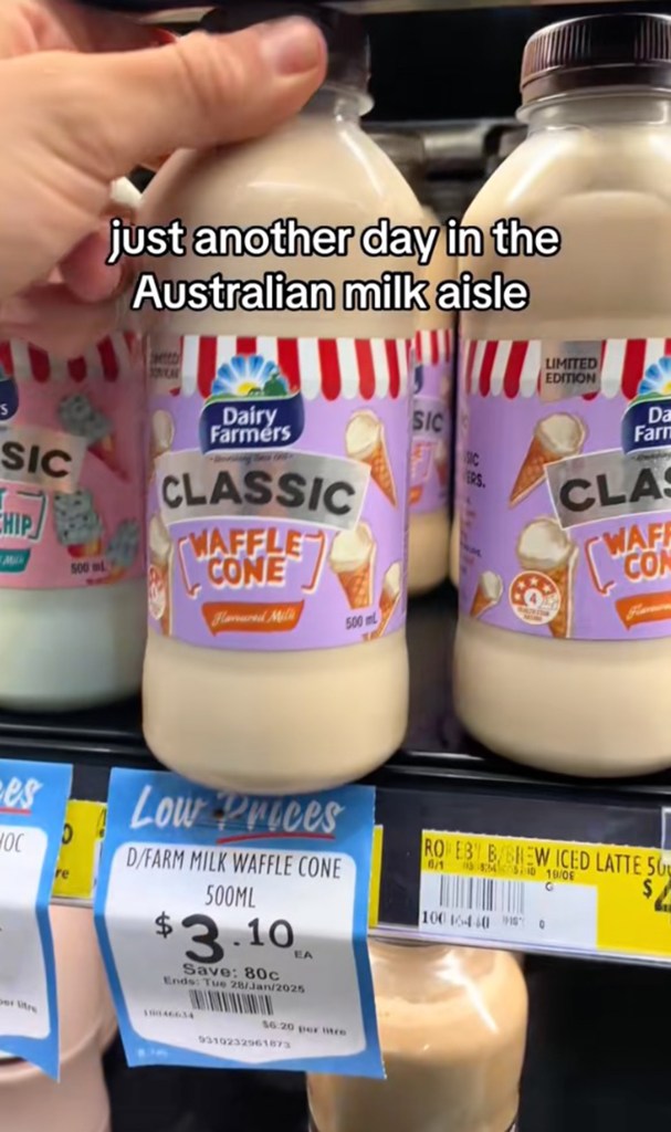 A tick that exhibits a variety of milk bottles with unique flavor at an Australian grocery store