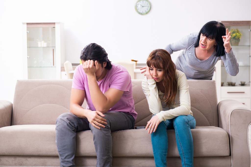 Family and young mother discussing family issues