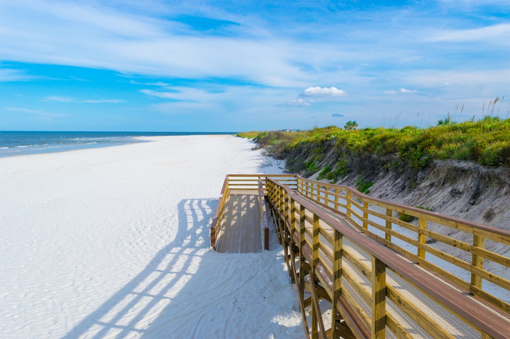 Historical city architecture near white sand beaches