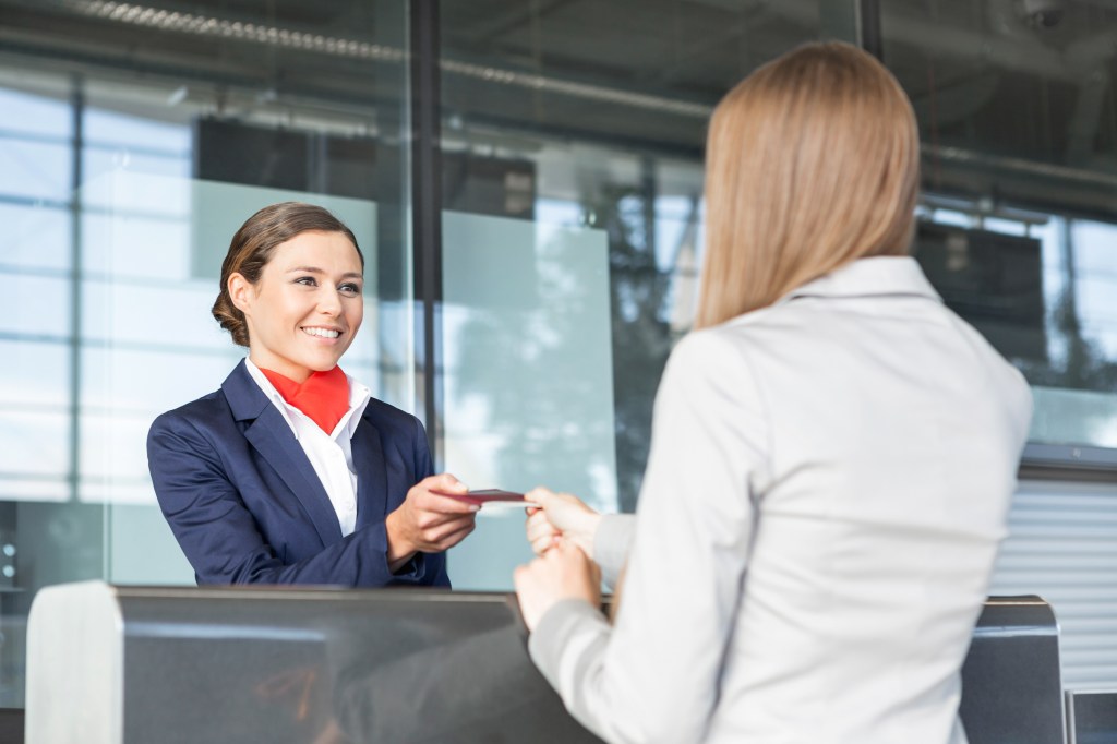 Passenger Service Agent by handing over a woman her passport and crossing the dormitory to an airport control zone