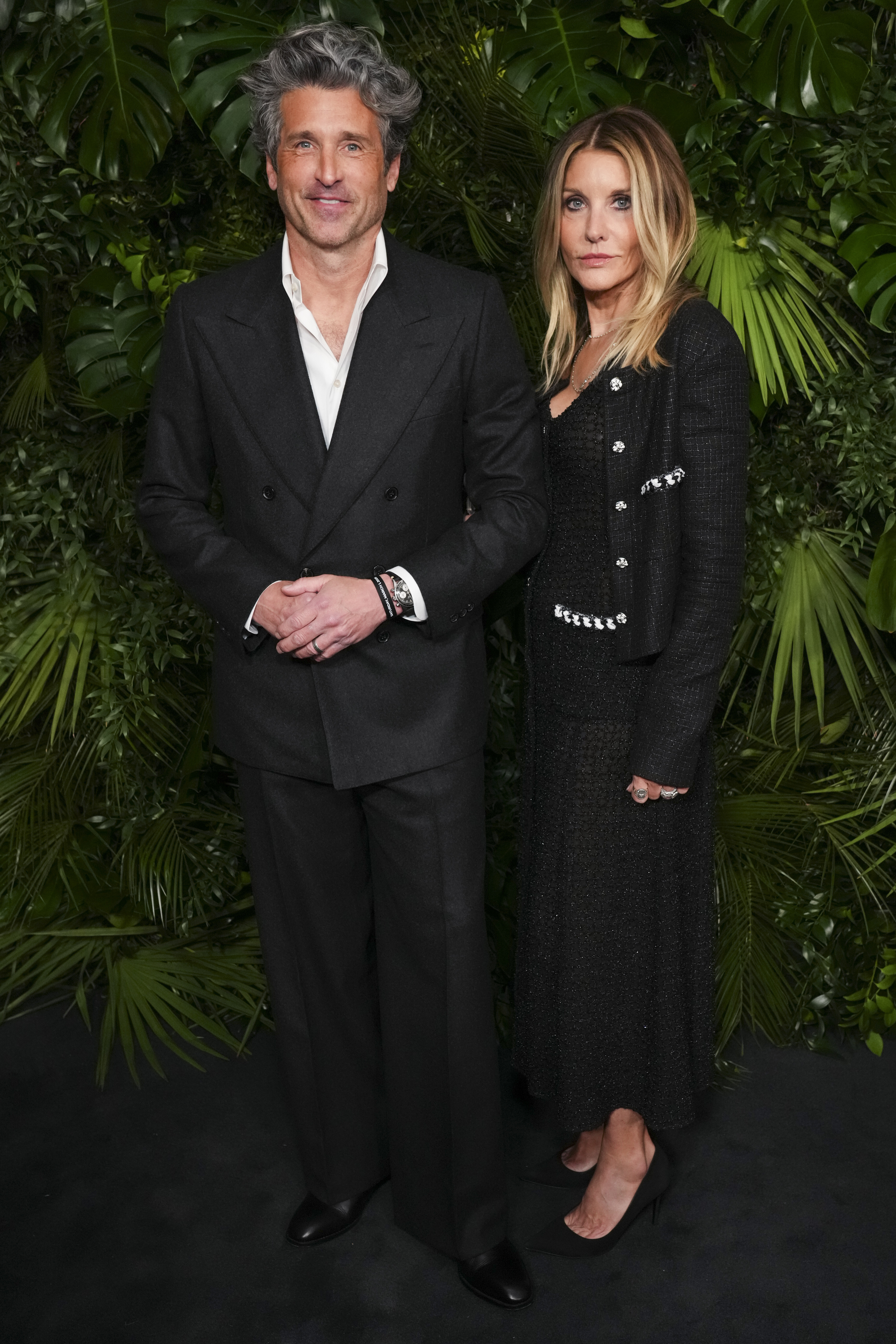 Patrick Dempsey, Left and Jillian Fink arrive at the 16th annual Oscar Dinner of Chanel on Saturday, March 1, 2025, at Beverly Hills Hotel in Beverly Hills